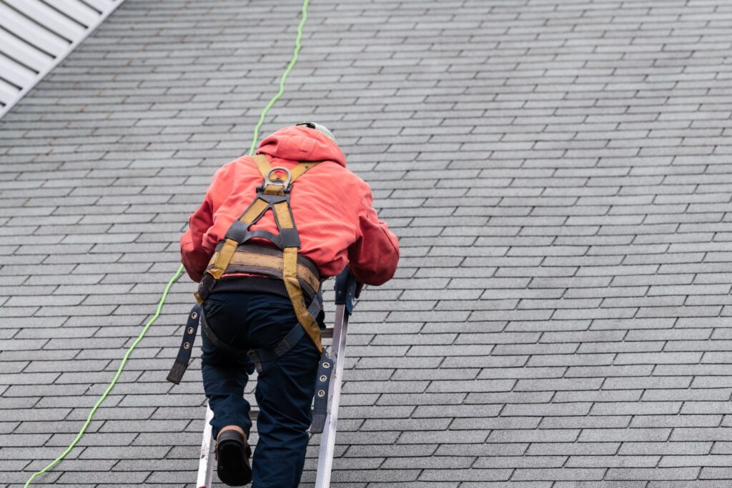 Man conducting roof inspection